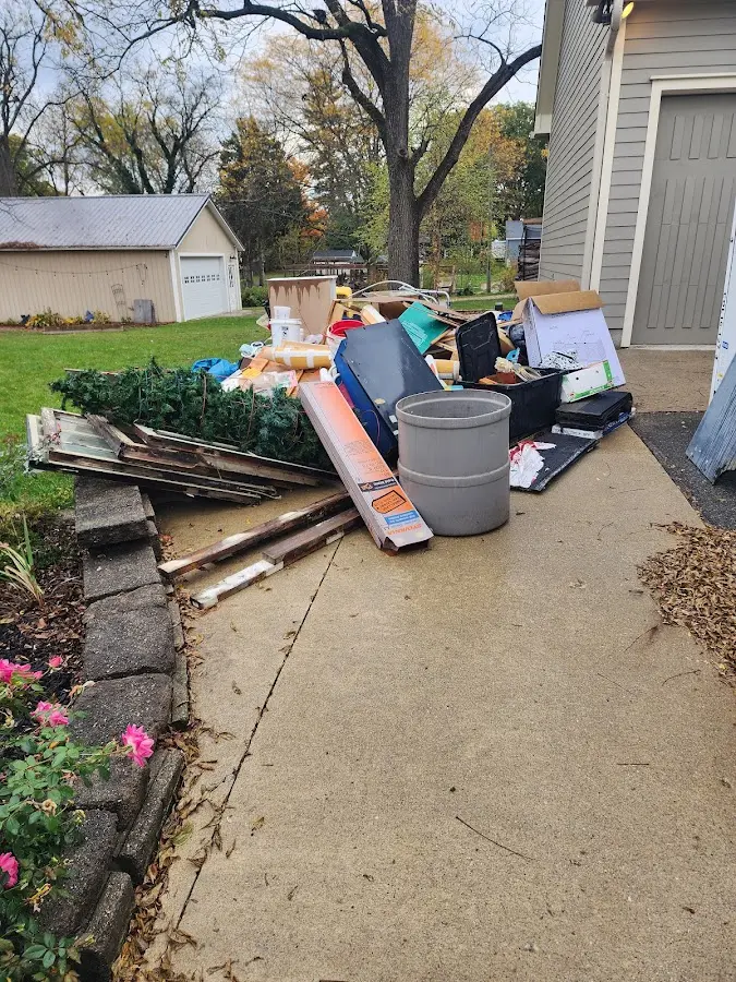 Dumpster being loaded with debris for Residential Dumpster Rental in Clay